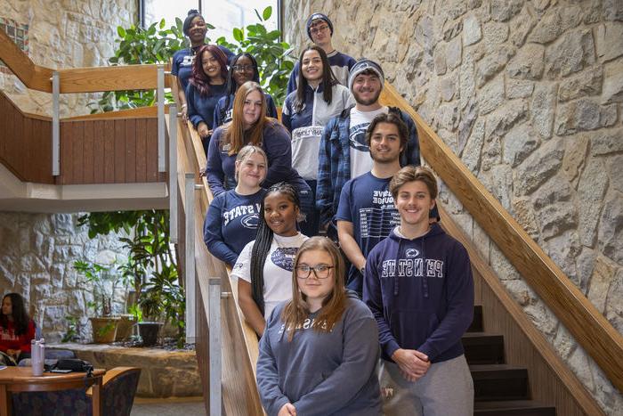 resident assistants for the villages line up along the Perkins Student Center stairs